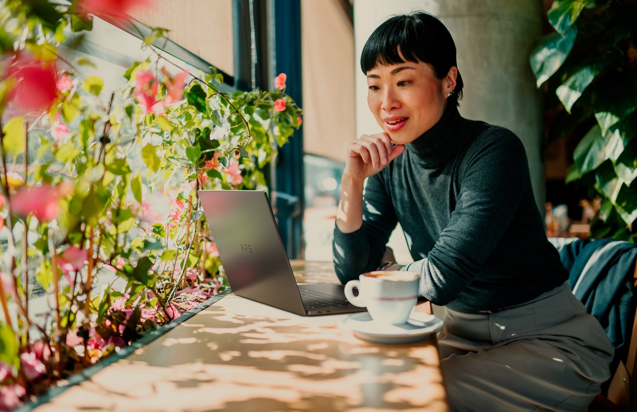 Women sitting with laptop at cafe